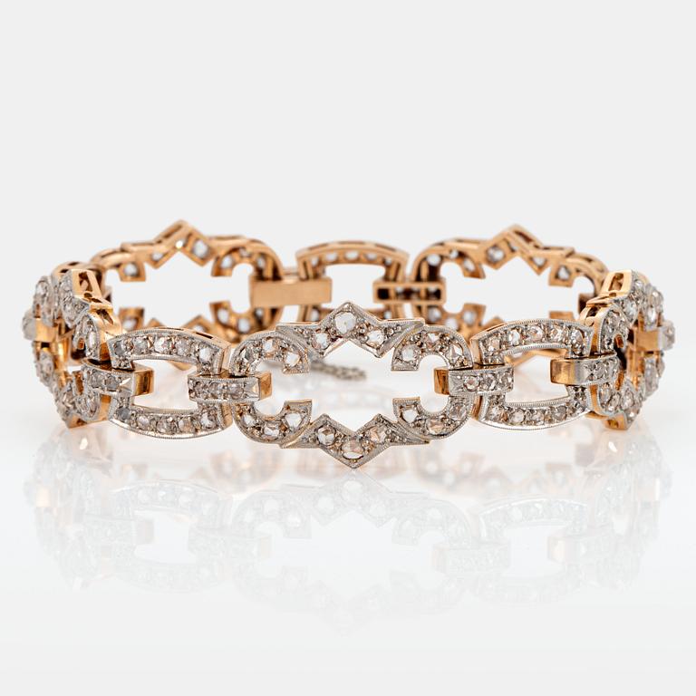A 14K gold and platinum bracelet set with rose-cut diamonds.
