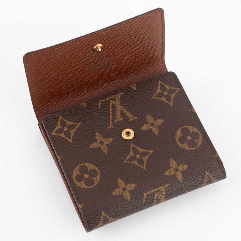 Louis Vuitton, makeup bag and wallet.