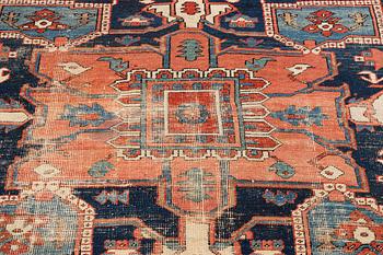 An antique Heriz carpet, ca 350 x 317 cm.