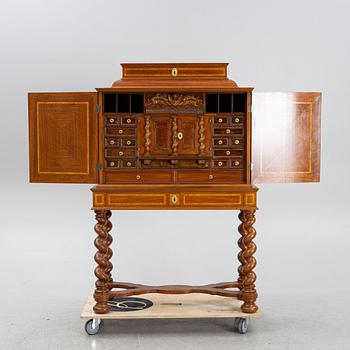 A Baroque style cabinet, circa 1900.