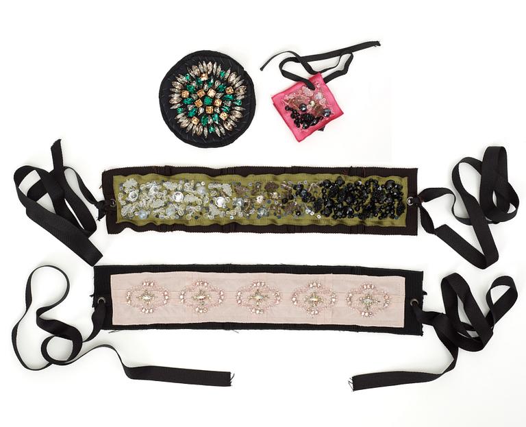 A set of two belt and two brooches by Prada.