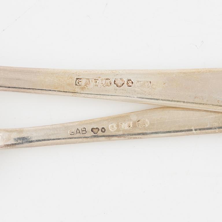 Guldsmedsaktiebolaget (GAB), 13 bordsskedar, 12 teskedar, silver, Stockholm 1943-1975.