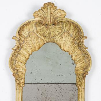 A giltwood rococo mirror, Stockholm, mid 18th century.