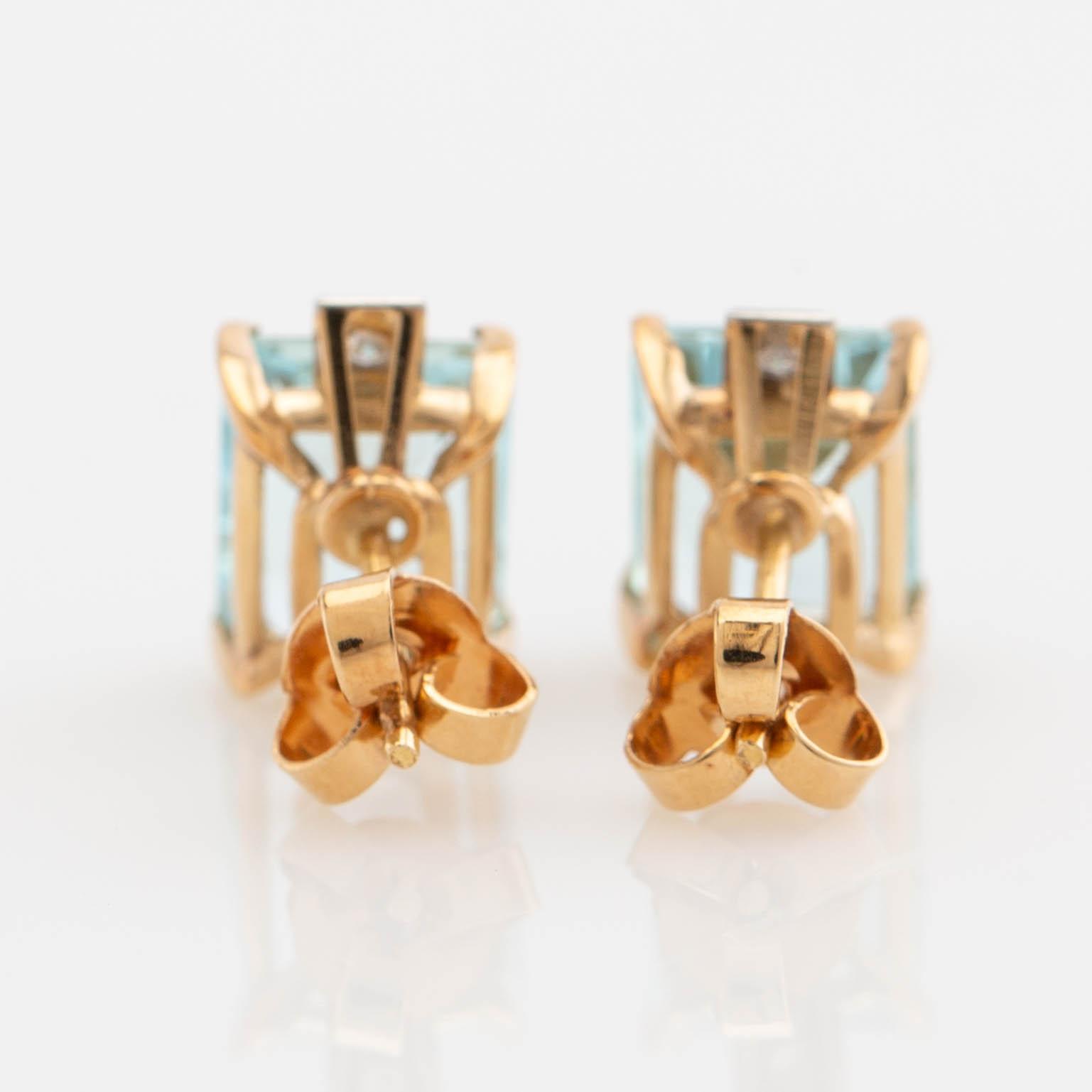 Earrings, a pair, 18K gold with aquamarines and diamonds.