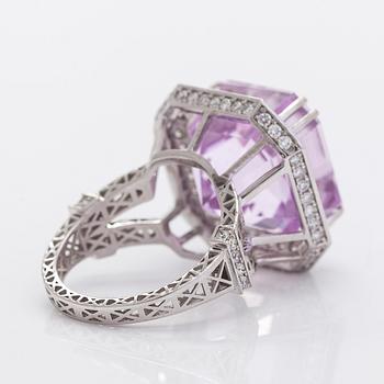 A 14K gold ring with kunzite and diamonds.