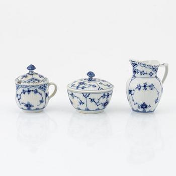 A 24-piece 'Musselmalet' tea service, Rifflet and half lace, Royal Copenhagen, Denmark.