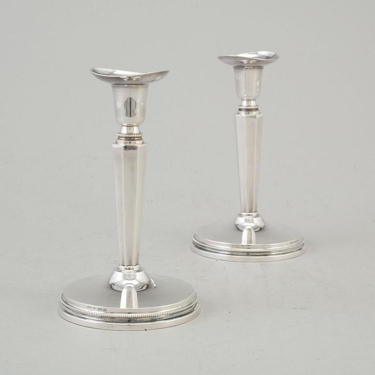 a pair if silver candlesticks by MGAB Uppsala 1962.