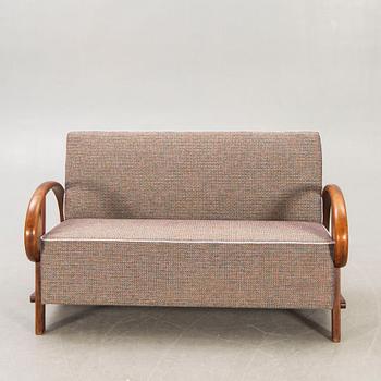 An Art Deco walnut sofa first half of the 20th century.