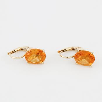 A pair of citrine earrings.