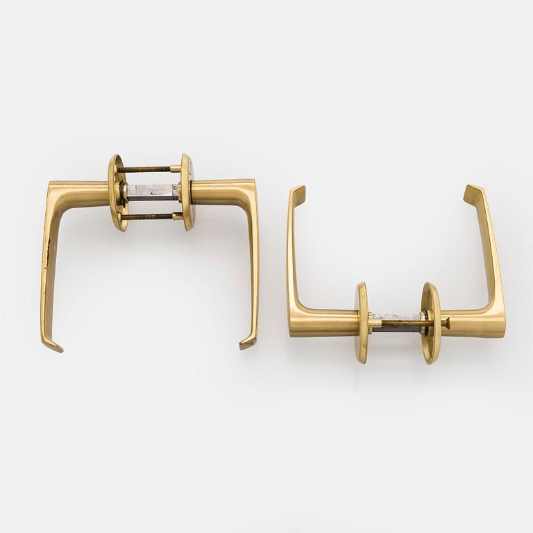 A set of eight 1960s-70s door handles.