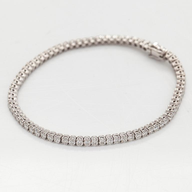 Tennis bracelet, brilliant-cut diamonds, 18K white gold.