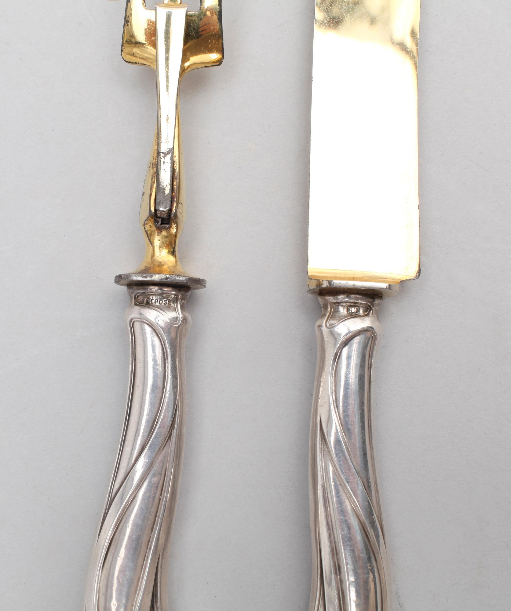UPPLÄGGNINGSBESTICK, 2 st, silver, jugend, sannolikt Frankrike, 1900-tal.