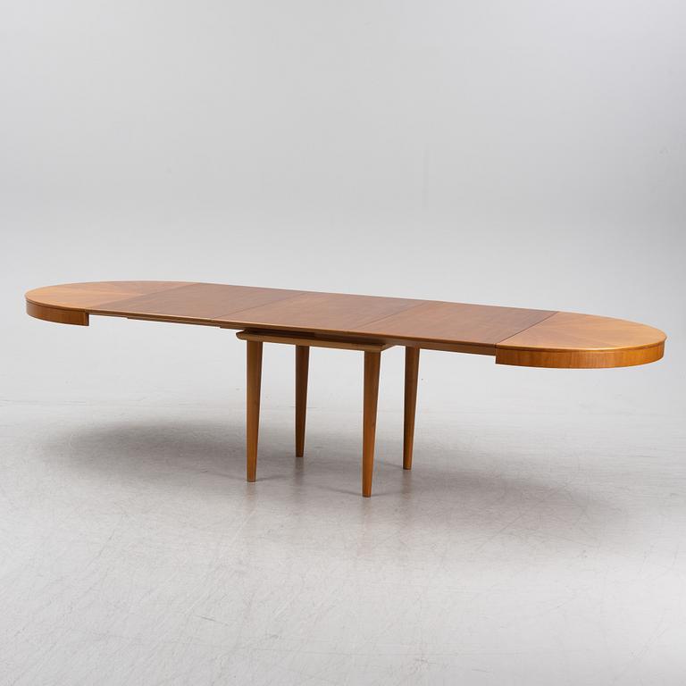 A mahogany veneered Swedish Modern dining table, 1950's.