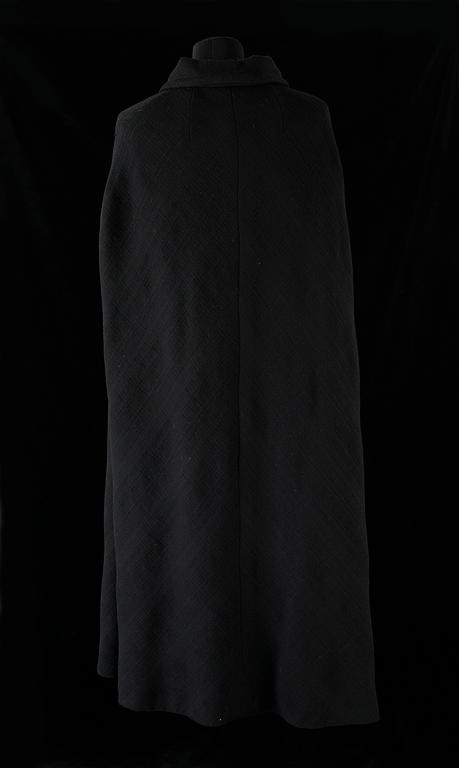 A black 1960s/70s cape by Hermès.