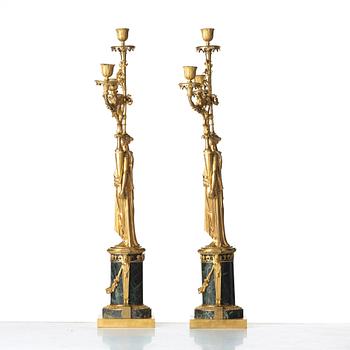 A pair of French Directoire three-light candelabra, circa 1800.
