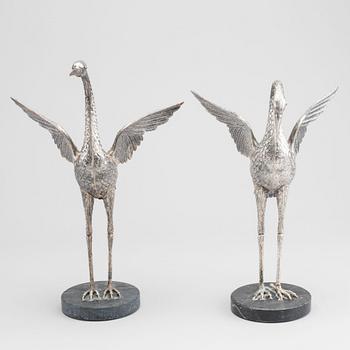 A pair of Spanish silver figurines, unmarked  receipt is included.