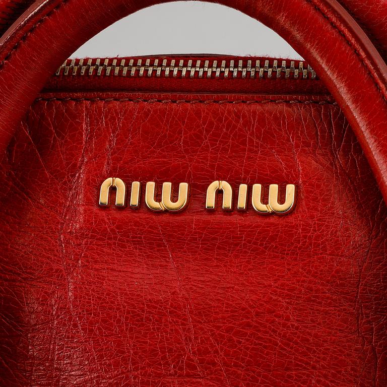 Miu Miu, a leather bag.