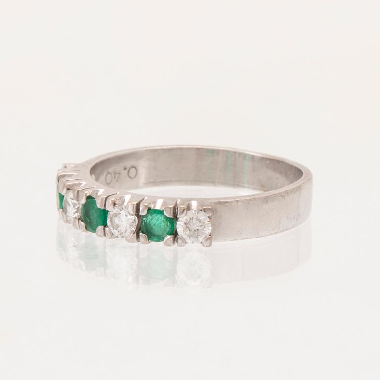 Ring half-eternity 18K white gold with round faceted emeralds and diamonds, Heribert Engelbert Stockholm 1981.