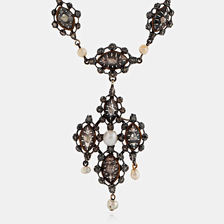 A silver necklace/pendant set with rose-cut diamonds and pearls.