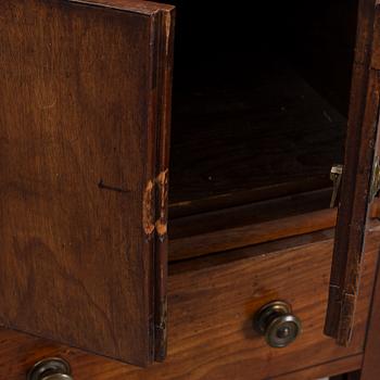 A mahogany bedside table, England, 19th century.