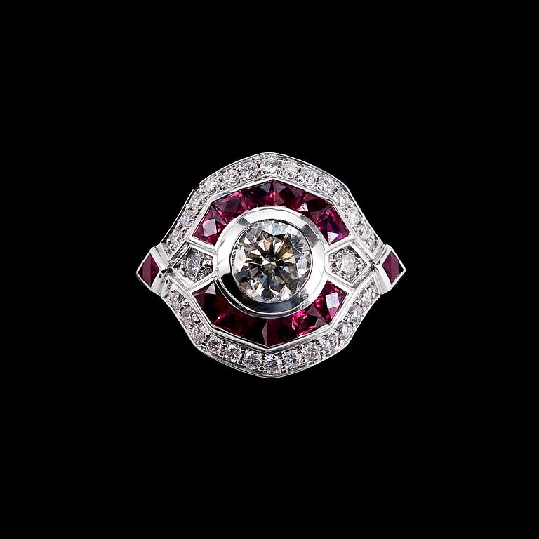 RING, briljantslipade diamanter 1 x 1.00 ct + 0.37 ct. Fancy slipade rubiner.