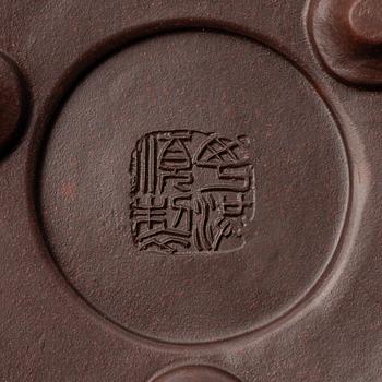 Two Chinese yixing teapots, early 1900s and 1980s.