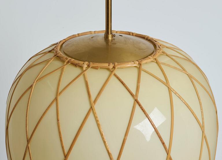 A pair of Swedish vanilla coloured glass ceiling lights with fretted rattan, 1930-40's.