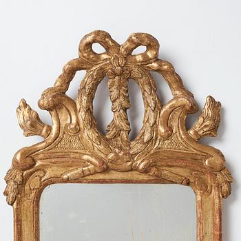 A pair of Gustavian one-light girandole mirrors by Johan Åkerblad, master 1758-1733 in Stockholm.