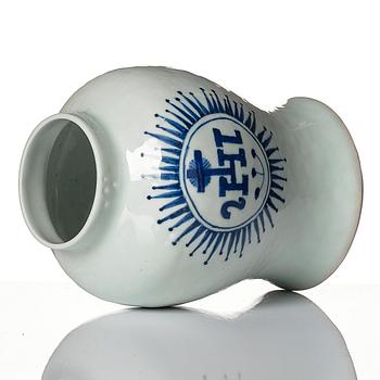 A small blue and white jar with the monogram IHS mirrored, Qing dynasty, 19th Century.