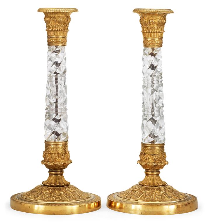 A pair of Russian circa 1830 gilt bronze and glas candlesticks.