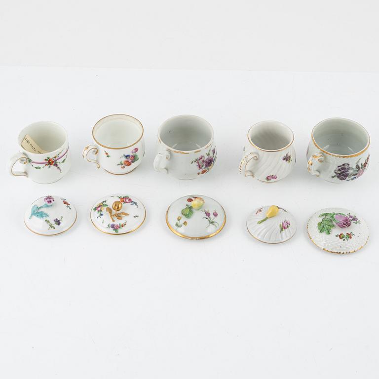 Two dinner plates and 11 custard cups with covers, 18th/20th Century.