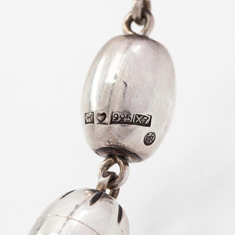 A set of sterling silver "Halikko treasure" necklace, bracelet, ring and earrings. Kalevala Koru, Helsinki 1975 and 1975.