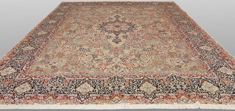 A 'Millefleur' Kerman Laver carpet, c. 398 x 300 cm.