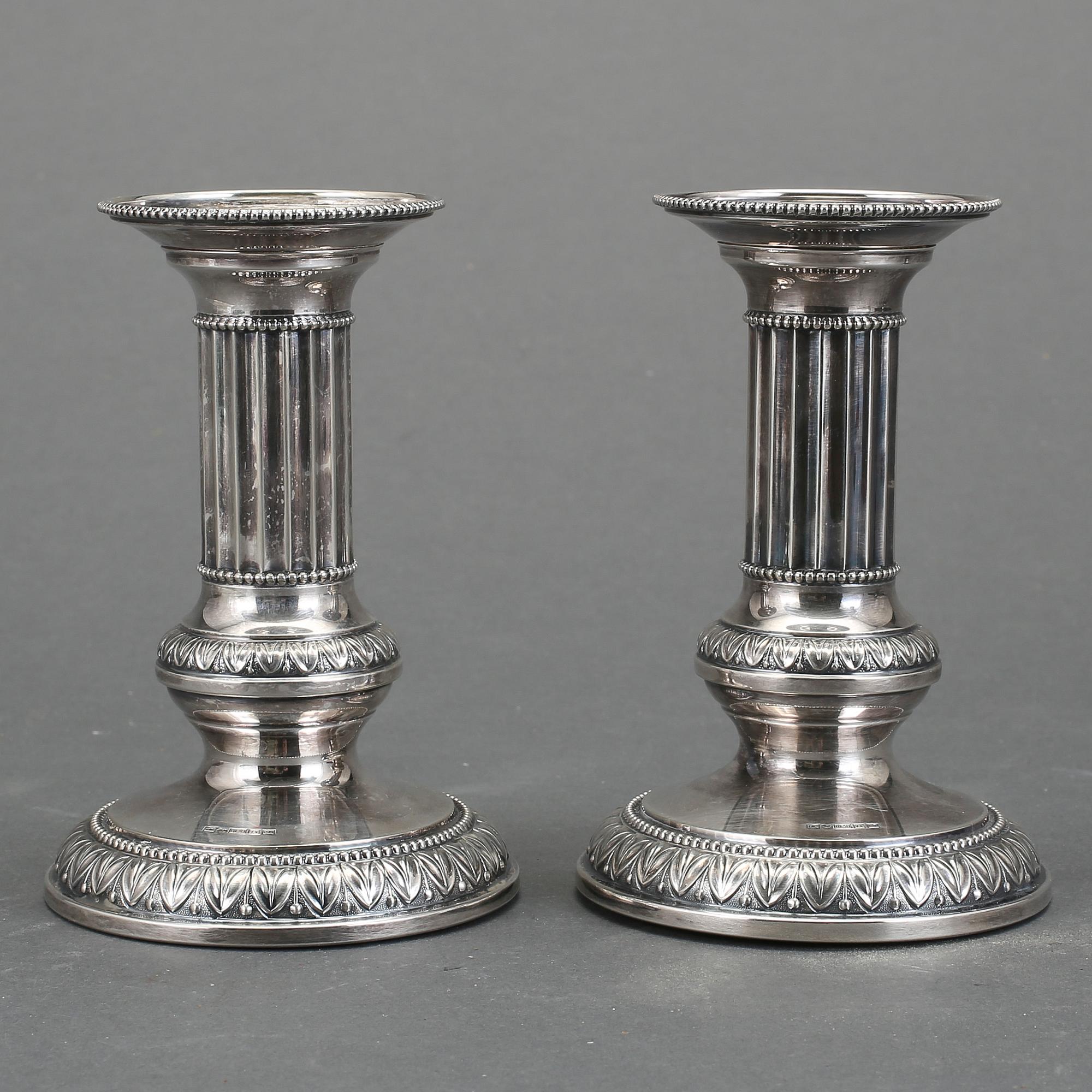 LJUSSTAKAR, ett par, silver, Turku/Åbo, omkring 1900-talets mitt.