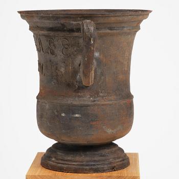 A cast-iron garden urn from Hellefors styckebruk, dated 1791.