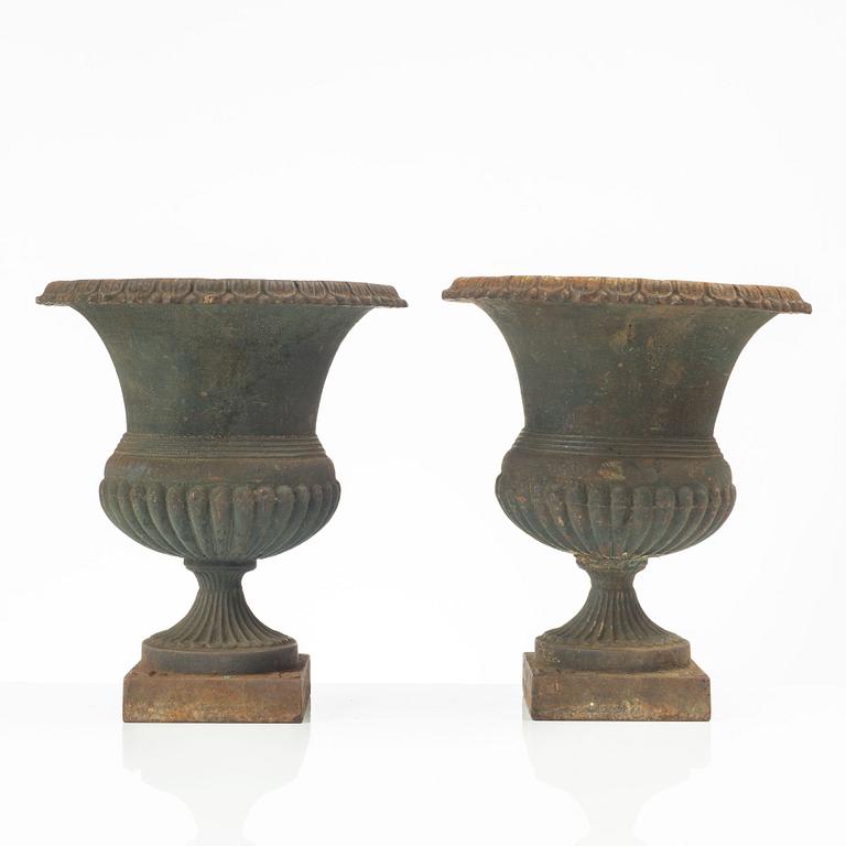 Garden urns, a pair, cast iron, marked No 15, 20th Century.