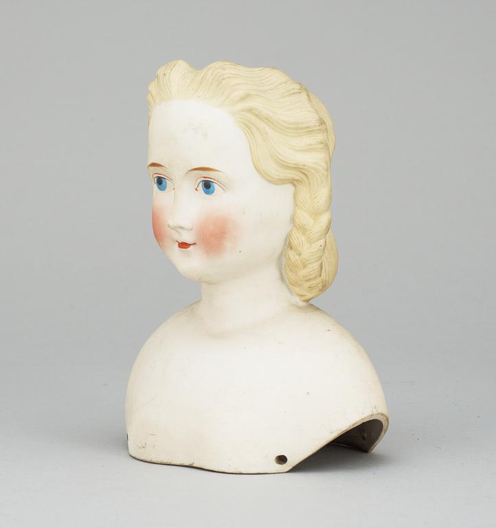 A 1860s-70s doll head, probably Germany.