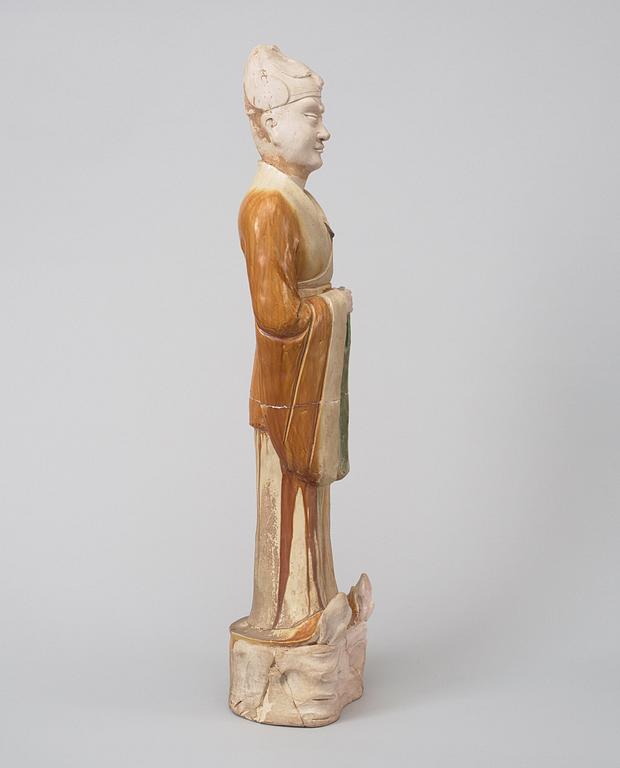 A potted, partially glazed tomb figure of a guardien, Tang dynasty (618-907).