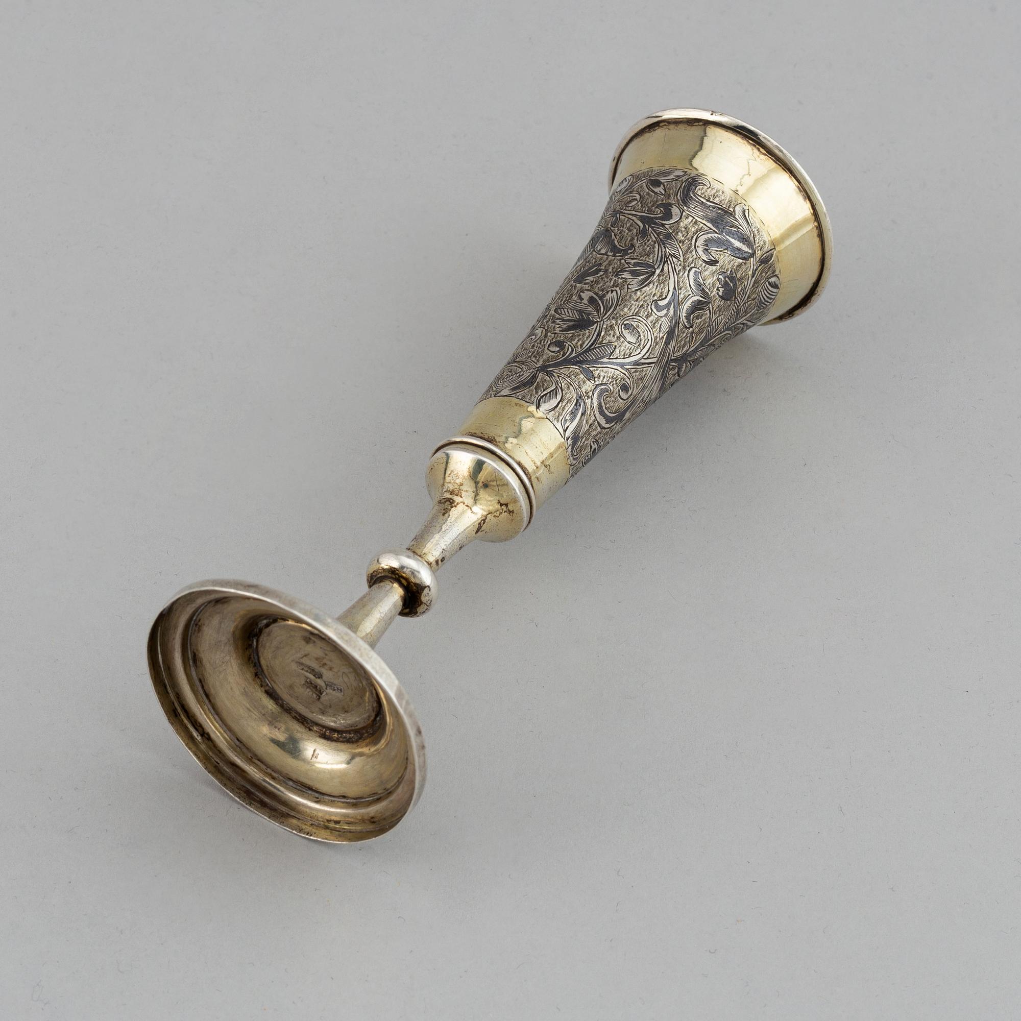 A Russian silver gilt and niello champagne flute, unidentified makers mark, Moscow 1843.