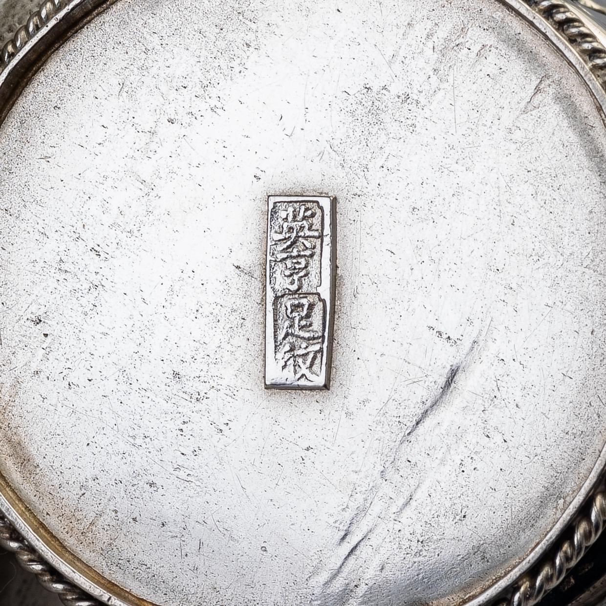 A silver bud vase, two stands for the butter knifve and a salt, China, early 20th Century.