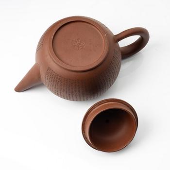 A 'calligraphy' yixing teapot, China, later part of the 1900s.