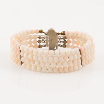 Bracelet with light pink coral, four strands.