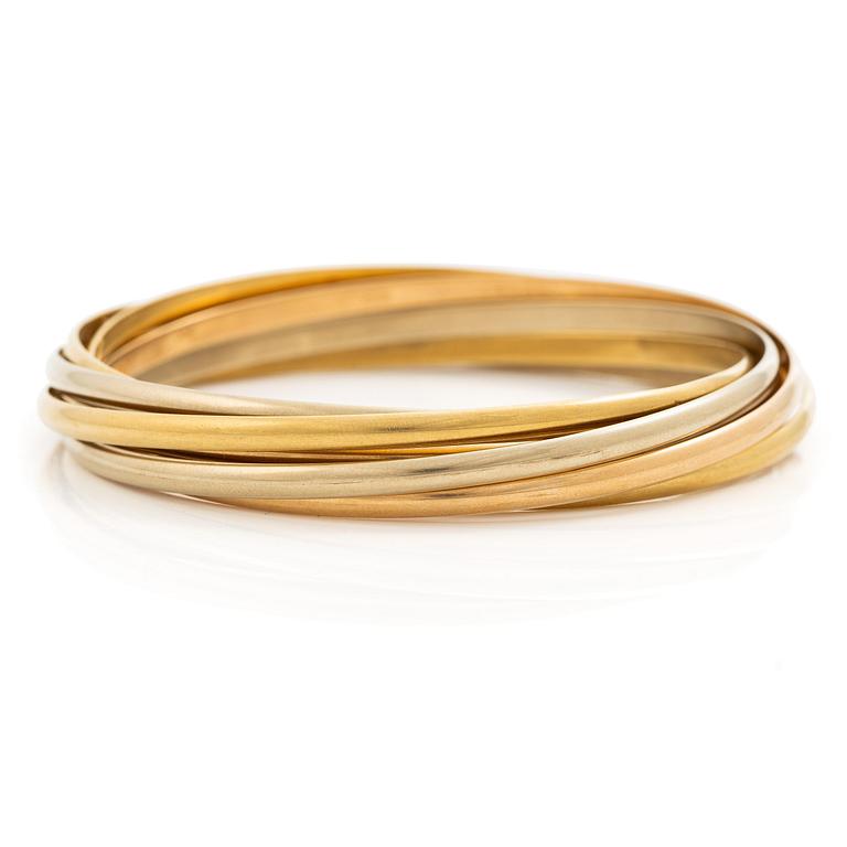 A Cartier bangle "Trinity" 18K gold in three colours.