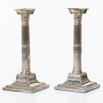 Four silver plated candlesticks, early 20th century.