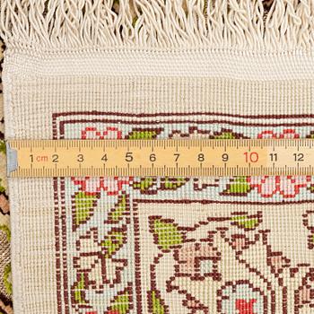 A silk an metal Hereke rug, West Anatolia, c. 100 x 68 cm.