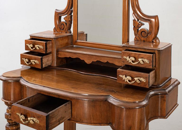 A second half of the 19th century table with mirror and a stool.