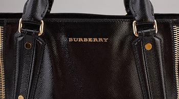 BURBERRY,  a black patent leather and suede handbag.