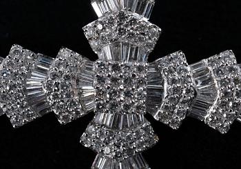 A CROSS,  brilliant and baguette cut diamonds c. 6.50 ct. Weight 14,3 g.