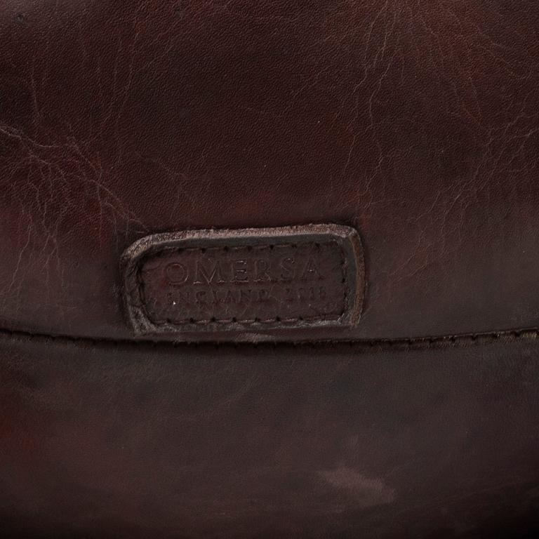 A leather footstool by Dimitri Omersa & Co.