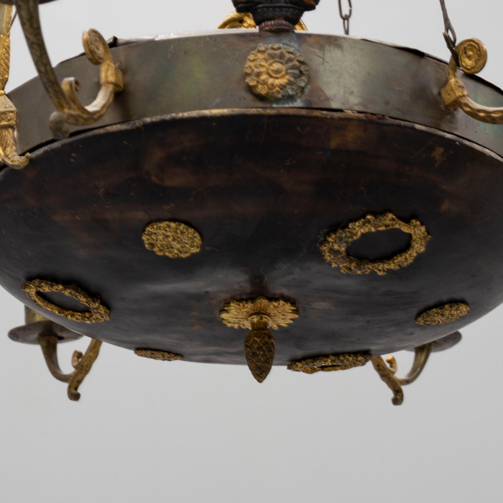 A hanging lamp, empire-style, first half of the 20th century.